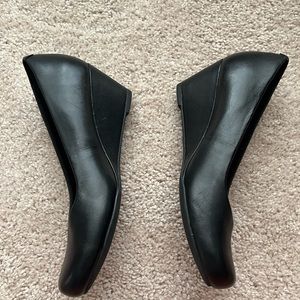 Black wedges, brand new. Never worn.